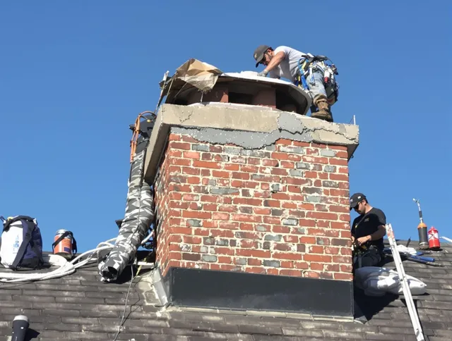 Ansonia Chimney Sweep installing a custom chimney crown in Ansonia, CT