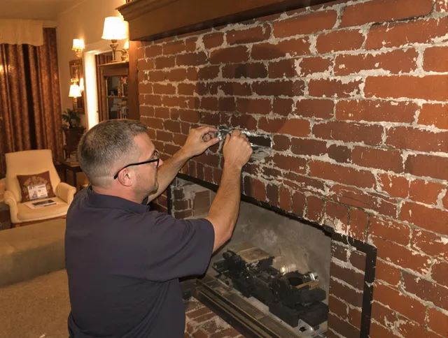 Ansonia Chimney Sweep expert fixing a fireplace in Ansonia, CT